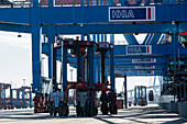 Straddle Carrier transporting containers in the block storage in the port of Hamburg, Hamburg, Germany