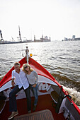 Couple on a ship, Hamburg Harbor, Hamburg, Germany