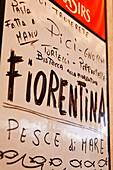 Restaurant sign listing Tuscan specialities, Tuscany, Italy