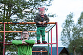 Father and son at a climbing frame, lake Carwitz, Conow, Feldberger Seenlandschaft, Mecklenburg-Western Pomerania, Germany