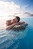 Woman relaxing in thermal lake