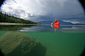 Vignetted Underwater Image of a Man Canoeing on Kusawa Lake, Yukon