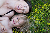 Mother and Child Lying on Grass, Toronto, Ontario