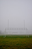 Old goalpost on a foggy football field, Otterburn park, Quebec
