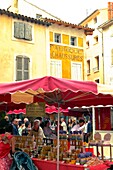 France, Vaucluse Department, Isle sur la Sorgue, jars of honey on a market stall