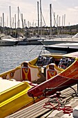 France, Provence, St Tropez, Marina with yellow and red racing boat