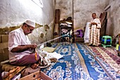 Kingdom of Morocco, Fes, Fes el Bali, Medina of Fes, People in a textile shop