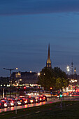 France, Bordeaux, Southwestern France, Aquitaine, Quai de la Douane, road traffic at dusk, St Michel's Church in the background