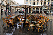 France, Bordeaux, Southwestern France, Aquitaine, Place de la Comédie, Terrace of a coffee, rainy day