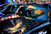 Neon reflections on car in Times Square,  New York City, New York State, United State, USA