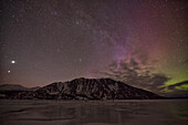 Aurora borealis dances over sheep mountain which is in kluane national park, yukon canada