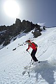 Female backcountry skier downhill skiing through Loferer Seilergraben, Berchtesgaden Alps, Berchtesgaden National Park, Upper Bavaria, Bavaria, Germany