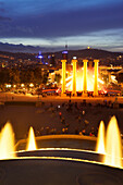 Illuminated fountain Font Magica with view to Barcelona, Palau Nacional, National Museum, Montjuic, Barcelona, Catalonia, Spain