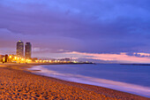 Twin towers Hotel Arts and Mapfre Tower at the beach, illuminated at night, Olympic village, Barceloneta, Barcelona, Catalonia, Spain