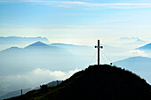 Cross at summit of Feldalpenhorn, Kaiser range, Hohe Salve and Loferer Steinberge range in background, Feldalpenhorn, Feldalphorn, Wildschoenau, Kitzbuehel range, Tyrol, Austria