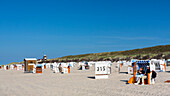 Beach chairs on the beach with dunes in the background, Spiekeroog Island, North Sea, East Frisian Islands, East Frisia, Lower Saxony, Germany, Europe