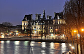 Town hall and the river Seine at night, Paris, France