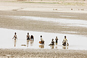 Children fishing in a waterhole, Benin