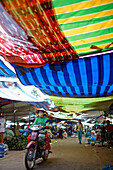 Market stalls under colourful canvas, Sa Dec, Dong Thap Province, Vietnam