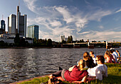 People relaxing on the banks of the river Main, Frankfurt am Main, Hessen, Germany