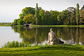 Nymph at the waters edge of the lake, view to the wolf's bridge, Woerlitz, UNESCO world heritage Garden Kingdom of Dessau-Woerlitz, Saxony-Anhalt, Germany