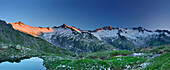 Panoramic view of snow-coverd mountains with lake Schwarzsee in foreground, Zillertal Alps, valley Zillertal, Tyrol, Austria