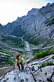 Woman ascending to Zugspitze, valley of Hoellental, Wetterstein mountain range, Upper Bavaria, Bavaria, Germany