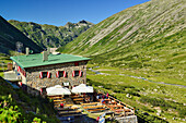 View to terrace of hut Osnabruecker Huette, Malta valley, Ankogel Group, Hohe Tauern National Park, Carinthia, Austria