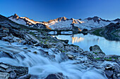 Mountain river flowing into lake Schwarzsee, Dritte Hornspitze, Turnerkamp and Grosser Moeseler in background, Zillertal Alps, valley Zillertal, Tyrol, Austria