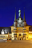 View over market square to illuminated town hall, Wernigerode, Saxony-Anhalt, Germany