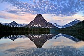 Sinapah Mountain reflected in Two Medicine Lake at dawn, Glacier National Park (Two Medicine sector), Montana, USA.