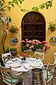 Tables and chairs at an outdoor restaurant in Sorrento, Campania, Italy