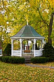 A gazeebo with fall foliage color in a small park in downtown Petoskey, Michigan, USA