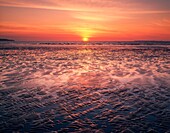 Sunset at Westward Ho! beach, North Devon, England.