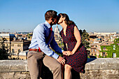 Couple kissing in the city of Rome Italy