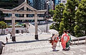 Women at main entrance of HieJinja shrine, Nagata-cho Tokyo city, Japan, Asia