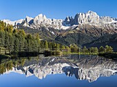 Rosengarten also called Catinaccio mountain range in the Dolomites of South Tyrol Alto Adige during autumn  Reflexion of the main peaks in a pond during late afternoon  The Rosengarten is part of the UNESCO world heritage site Dolomites  Europe, Central E