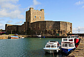 Carrickfergus, Co Antrim, Northern Ireland, UK, Europe  View across the water to the 12th century Norman castle on Belfast Lough