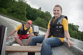 Members of the DLRG practicing rescue situations on a lake, German Life Saving Association, Rainau Buch, Aalen, Baden-Wuerttemberg, Germany