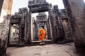 Monk Walking Through Temple, Angkor Wat, Cambodia