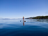 Woman Paddling on Lake