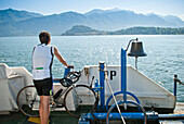 Man With Bicycle on Ferry Crossing Lake Como, Italy