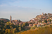 Hillside Village with Hot Air Balloon in Background, Monforte d’Alba, Italy
