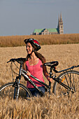 Bicycle Tourists In A Wheat Field Near The Chartres Cathedral, Eure-Et-Loir (28), France