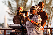 Reggae Singer And Her Band During A Concert At Rick'S Cafe, Negril, Jamaica, The Caribbean