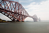 'Forth Bridge Going Over The Water In The Fog; North Queensferry Scotland'