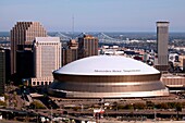 Aerial of the Superdome with the Crescent City Connection in the background