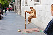 Paul, Quayle, Festival, Outdoors, Day, Side View, Full Length, Mid-Air, Holding, Incidental People, One Person, Street, Pavement, Diminishing Perspective, Accuracy, Balance, City Life, Confidence, Skill, Street Artist, Trick, Gold Color, Stick, April Fear
