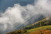 Electricity pylons in fog, Kaprun, Salzburg, Austria