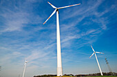 Wind turbines and electricity pylons, Dortmund, North Rhine-Westphalia, Germany